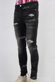 Black damaged skinny jeans