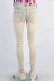 Yellow acid washed damaged skinny jeans