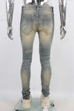 Green vintage damaged skinny jeans