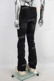 Black patchwork damaged boot cut jeans