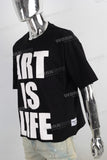Black screen print boot cut t shirt