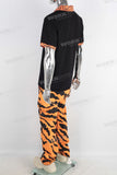 Black embroidered t shirt and tiger pattern pants