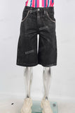 Black waxed patchwork shorts