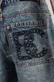 Blue patchwork damaged boot cut shorts