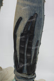 Men's Blue Ripped Jeans with Black Leather Patch