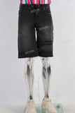 Black embroidered boot cut shorts