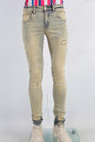 Yellow damaged skinny jeans