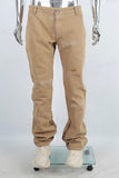 Yellow paint splatters stack jeans