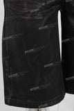 Black waxed patchwork shorts