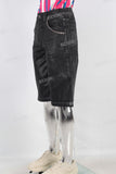 Black waxed patchwork shorts