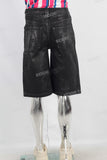 Black waxed patchwork shorts