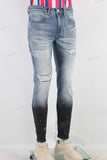 Blue damaged paint splatters skinny jeans