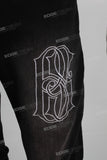 Black damaged embroidered zip up stack jeans