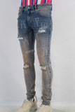 Acid washed damaged laser skinny jeans