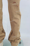 Yellow paint splatters stack jeans