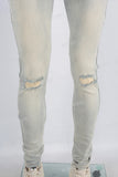 Acid washed damaged skinny jeans