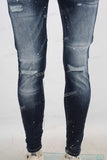 Blue damaged paint splatters skinny jeans