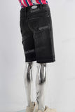 Black embroidered boot cut shorts