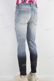 Blue damaged paint splatters skinny jeans
