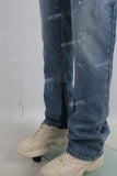 Blue stack patchwork paint splatters jeans