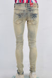 Yellow damaged skinny jeans