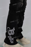 Black damaged embroidered zip up stack jeans