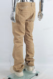 Yellow paint splatters stack jeans