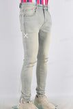 Acid washed damaged skinny jeans