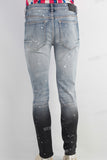 Blue damaged skinny paint splatters jeans
