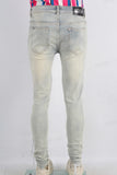 Acid washed damaged skinny jeans