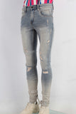 Blue acid washed damaged skinny jeans