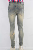 Acid washed damaged embroidered skinny jeans