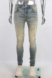 Green vintage damaged skinny jeans