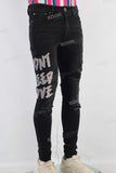 Black patchwork damaged skinny jeans