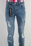 Blue damaged skinny stack jeans