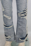 Blue damaged bell bottom jeans