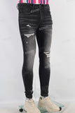 Black damaged skinny jeans