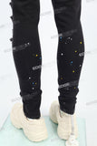 black distressed paint splatters skinny men jeans with screen printed logo