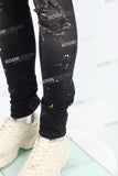 black distressed paint splatters skinny men jeans with screen printed logo
